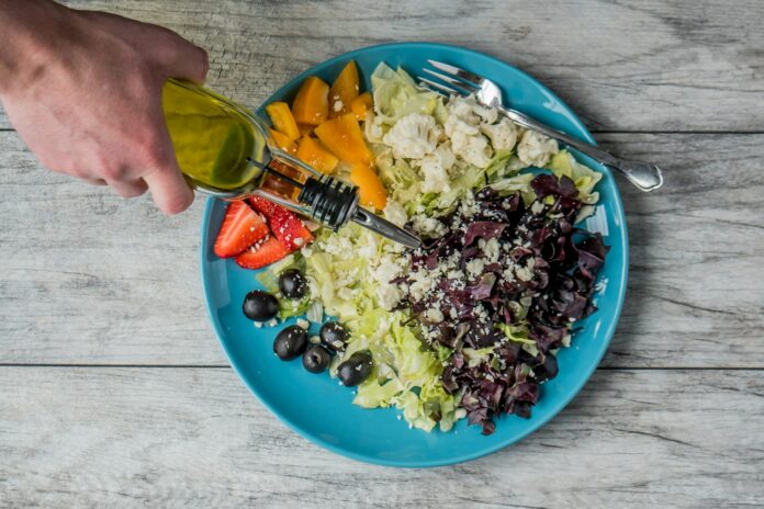 Photo by Jessica Lewis 🦋 thepaintedsquare flat lay photography of man making vegetable and fruit salad