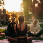 여성 건강관리, 일상 속 작은 실천이 만든다 a group of people sitting on top of a lush green field