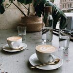 홈 카페 시대, 건강하게 커피를 즐기는 새로운 습관 뜬다 clear glass bottle near cappucino